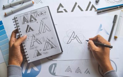 Graphic designer development process drawing sketch design creative Ideas draft Logo product trademark label brand artwork. Graphic designer studio Concept.